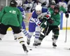 A pair of Colony Knights work to push Palmer's Owen Hayes off the puck during a 5-1 win over the Moose Tuesday at the MTA Events Center in Palmer. Jeremiah Bartz/Frontiersman