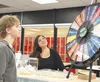 The 'Wheel of Reality' introduced students to life's unpredictability. When a student spun a surprise event, they could expect outcomes ranging from receiving a cash bonus to having a baby. K