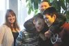 Scott Godwin puts his recently adopted sons Michael, 15 (right), and Rodney, 13, in headlocks while posing for a family photo at their home on Lazy Mountain Saturday while his wife, Kelly God