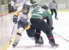 ROBERT DeBERRY/Frontiersman Alaska Avalanche forward Matthew
Friese maneuvers past Keni River Brown Bear Russ Whited.
