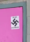 Officers are asking for the public’s help in identifying the person or persons responsible for placing swastika stickers on two buildings. The stickers are white with a black swastika in the 