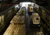 Loadmasters, assigned to the 15th Airlift Squadron from Joint Base Charleston, S.C., offload a mobile field hospital from a C-17 Globemaster III at Norman Manley International Airport in King