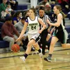 Redington's Abbie Fuller drives the ball down the floor during a loss to Nikiski Saturday at Redington. Fuller led her team with 17 points in the game. She also helped Redington beat Homer on