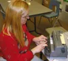 CASEY RESSLER/Frontiersman Jacinda Danner uses a Braille writer
to type a few words in her Teeland Middle School classroom
Tuesday.