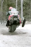 ROBERT DeBERRY/Frontiersman Iron Dog racer Todd Minnick gets his
front end in the air as he speeds over a set of whoops along the
Iron Dog trail Sunday afternoon. Minnick and teammate Nick Ol