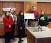 Wells-Fargo Bank Alaska Palmer store manager Debbie Retherford
presented a $10,000 donation to the local non-profit Valley
Residential Services last week. VRS director Bill Scharrer is
accept