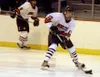 Houston's Wade Williams looks to pass across the zone during the
Hawks' 7-2 win over Nikiski on Friday. Williams registered a goal
and four assists before a brutal hit sent him out of the gam
