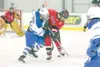ROBERT DeBERRY/Frontiersman Palmer defenseman Dylan Danielowski
faces off against Kenai Kardinal Reed Ehrhardt during the third
period of Thursday's game at the Palmer Ice Rink.