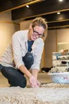 Alida van Almelo works with clay in her studio. Courtesy photo by Todd Paris