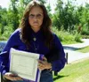 Donna Buckwalter shows the documents she has gathered to help
show she is working hard to gain her children back after they were
removed from her care in a Division of Family and Youth Servic