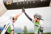 Julie Berberich and Kristin Wolf high five after breaking the women's record in the 200-mile, two-person relay version of the Fireweed 400 bicycle race — the 'Great Alaska Double Century' — J