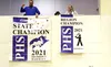 Palmer High principal Paul Reid displays the Palmer Moose state championship baseball banner. Bruce Eggleston/matsusports.net