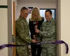 From left, U.S. Air Force Col. John Caranta III, the 673d Mission Support Group commander, Meghan Goven, Non-Appropriated Fund Human Resources director, and U.S. Air Force Lt. Col. Diamond Co
