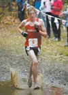ROBERT DEBERRY/Frontiersman Michael Johnston splashes through
the mud on his way to a third place finish in the Region III Cross
Country Championships last year. Johnston has been invited to
