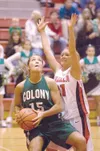 ROBERT DeBERRY/Frontiersman Colony senior Kate Klapperich posts
up while Wasilla senior Leisl Brown defends during a 41-30 Warriors
win over their cross-Valley rival.
