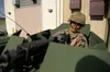 Alaska Army National Guard Spc. Kassie Miranda assigned to Alpha Company, 49th Missile Defense, Ground Based Interceptor Security Company, looks down the barrel of an M240 Bravo machine gun a