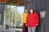 Wasilla Library youth services librarian Sara Saxton (left) and Jeanne Troshynski, president of the Wasilla Library Association (right) stand outside Wasilla Library during the five year anni
