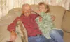 GREG JOHNSON/Frontiersman Marsha Carlisle compares the hair of
her brother, Roger Paul, to their father’s. The siblings met for
the first time last Tuesday.
