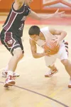 Wasilla guard Joel Quenga makes a move past Enumclaw guard
Taylor Myers during a 46-33 loss to the Hornets during the final
day of Doc Larson'€™s Roundball Classic at Wasilla High School.
ROB