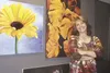 Karen Lopez, owner of NuKreationZ Art and Creativity Center, poses with some colorful works at her new gallery, which celebrated its grand opening Saturday in downtown Palmer. GREG JOHNSON/Fr