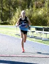 Chugiak's Campbell Peterson sprints to a win in the girls race of the George Plumley Invitational at Palmer High School. Bruce Eggleston/matsusports.net