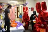 AKtive Soles employees Mackenzie Sprague and Jeremy Allen hand out candy during the 2022 Trick or Treat Street event. Jacob Mann/Frontiersman
