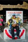 Brent Sass with two of his dogs after winning the 2022 Iditarod. David Poyzer/Iditarod