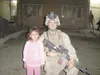 Photo courtesy LCPL Casqueira Lance Cpl. Alex Casqueira poses
for a picture with a small girl in Huesaybah, Iraq, during his
first tour in 2006. Casqueira will be depolyed again in
September.
