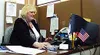 Judy Michlig works at her desk at the Mat-Su Job Center. Michlig
first went to the center trying to find a job, and now she's
helping others do the same thing -- as an employee of the
center.