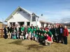 Students from Japan and Wasilla High School pose for a photo with the film crew for 'The Samurai Musher,' a documentary on Iditarod Trail pioneer Jujiro Wada, and public officials from both c