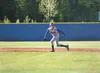 Alaska Road Warrior Shane Andrews watches the pitch as he leads off of first base during Friday’s 10-0 win over the Chugiak Mustangs at Lou McManus Field in Wasilla. ROBERT DeBERRY/Frontiersm