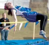 Palmer’s Kalene Smith clears the high jump during the Palmer
Realys at Palmer High School. ROBERT DeBERRY/Frontiersman