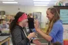 Hannah Wolff and Katelyn Larimer share a laugh while making masks together during third period Adaptive Art. Wolff and Larimer each have a partner who they help with art projects. This course