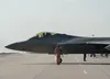 A U.S. Air Force Airman assigned to the 90th Expeditionary Fighter Squadron (EFS) salutes an F-22 Raptor pilot as he taxis for take-off at Łask Air Base, Poland, Aug. 16, 2022. The 90th EFS f