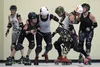 Bailey 'Revolution Riot' Stuart, left, collides with Rae 'Knockems Raezor' Cunningham in a Boom Town Derby Dames scrimmage at a team practice at the Mat-Su Borough Gym in Palmer on Tuesday. T