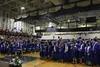 Members of Palmer High School’s class of 2019 throw their caps into the air. Tim Rockey/Frontiersman
