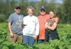 Lucas Pyrah, left, along with his mother, Katie, father, Ted,
and sister, Janet Dinwiddie, stand among the rhubarb crop at
Pyrah’s Pioneer Peak Farm in the Butte. The Pyrahs are the 2010
Alas