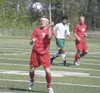 JEREMIAH BARTZ/Frontiersman Wasilla’s Chance Morrison heads the
ball during a 3-1 loss to the Service Cougars at Chugiak High
School.
