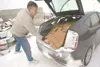 ROBERT DeBERRY/Frontiersman Lynn Mickleson empties his
packed-to-the-roof car full of cardboard boxes at the Valley
recycling center Monday afternoon. Mickleson makes a daily drop-off
of recy