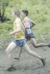 Kodiak’s Trevor Dunbar, left, and Palmer’s Jake Parisien battle
for the lead midway through the boys 4A cross country race at the
Palmer Invitational Saturday. Parisien passed Dunbar shortly 