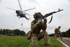 A Ukrainian Ground Forces soldier provides security during a fast rope from a Ukrainian Mi-8 helicopter as part of Rapid Trident 2021 at Combat Training Center-Yavoriv near Yavoriv, Ukraine, 