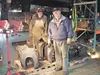 Ron Dudley and Lynn Willis clean the drive boxes by hand for Engine No. 557. Courtesy photo