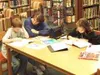 The Wasilla city council turned down a plan to move the library
into a leased space last Monday. Karen Rathgeber helps 10-year-old
Ian Rathgeber with his English text last week while her daug