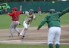 Mat-Su head coach Ben Taylor waves Levi Jordan home during a 5-3 win over the Peninsula Oilers Friday, June 24, 2016, at Hermon Brothers Field in Palmer. Jeremiah Bartz/Frontiersman