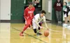 Colony senior Anton Chamblee works to pick up a loose ball as he's defended by Wasilla freshman Daniel Headings during a 67-50 win over the Warriors January 19, 2016, at Colony High School. C