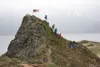 Spectators watch first- and second-place finishers David Norris and Scott Patterson round the highest point on Bird Ridge and head for the finish line of the 2016 Robert Spurr Memorial Hill C