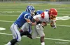Palmer's Nick Daniels and Wayne Hershman bring down West Valley's Dv'nn Cooks during a 35-28 loss to the Wolfpack Sept. 12 at Palmer High School. Courtesy Bruce Eggleston/matsusports.net