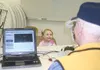 GREG JOHNSON/Frontiersman Two-year-old Allie Childs smiles while
taking an eye exam Wednesday at Amazing Grace Academy in Palmer.
Childs was one of a handful of children in the academy’s Kid’