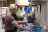 Jacob and Angelina work together as a team on the dishes.JPG