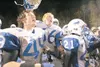 ROBERT DeBERRY/Frontiersman Palmer Moose JD Mitchell, left, and
Brandon Dezarm, middle, celebrate Palmer's win with the rest of the
Moose football squad as they run onto the field Friday nigh